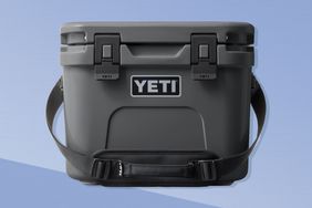 The Yeti Roadie 15 Hard Cooler on a blue background