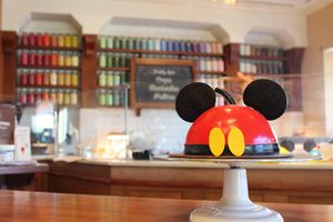 a Mickey Mouse hat in Amorette's Patisserie at Disney Springs