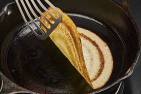 Dosa cooking in skillet