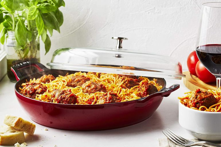 STAUB Braiser with Glass Lid, 3.5-Qt being served on a table