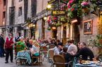 A view of outdoor dining along a street in Madrid