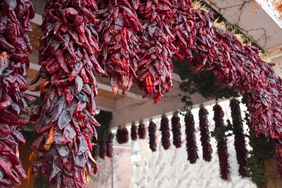 Numerous chile ristras decorating a porch in Albuquerque, New Mexico.