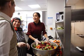 LONDON, ENGLAND - NOVEMBER 21: Meghan, Duchess of Sussex visits the Hubb Community Kitchen to see how funds raised by the 'Together: Our Community' Cookbook are making a difference at Al Manaar, North Kensington on November 21, 2018 in London, England. 