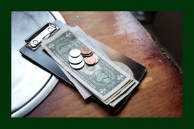 Tip money on a restaurant's table.