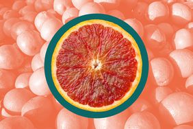 A blood orange in a photo composite over a pile of oranges. 